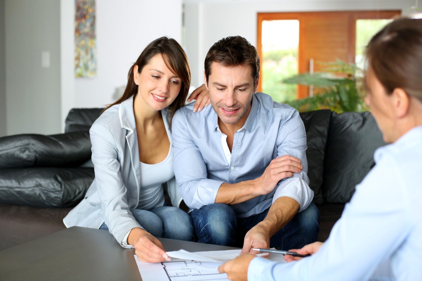 Couple reviewing an insurance plan with an advisor